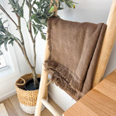 Chocolate brown fringed linen throw blanket draped over wooden ladder – 100% OEKO-TEX® certified linen