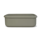 Green storage bento container with lid on a white background
