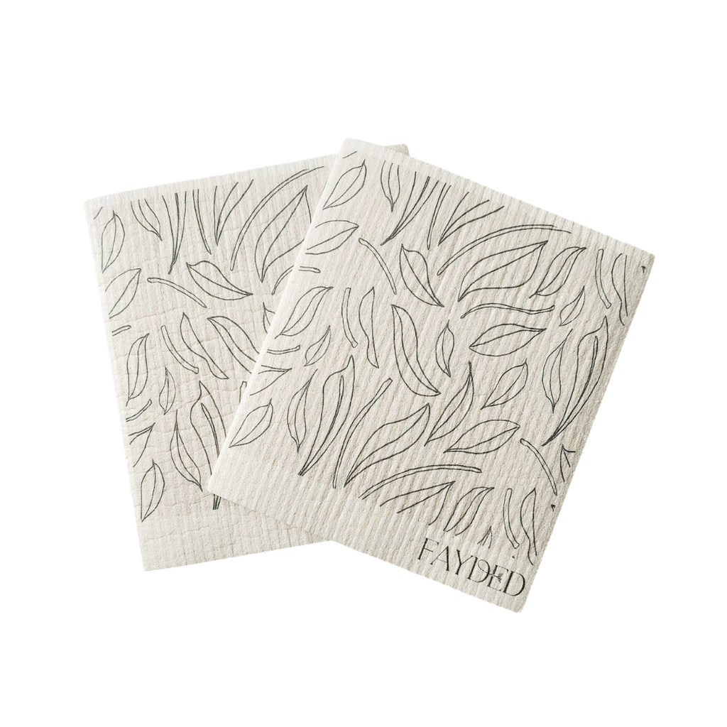 Two beige cloth (swedish) with leaf pattern and 'Fayded' branding on a white background