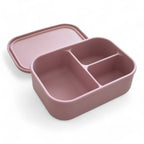 Pink bento box with compartments on a white background