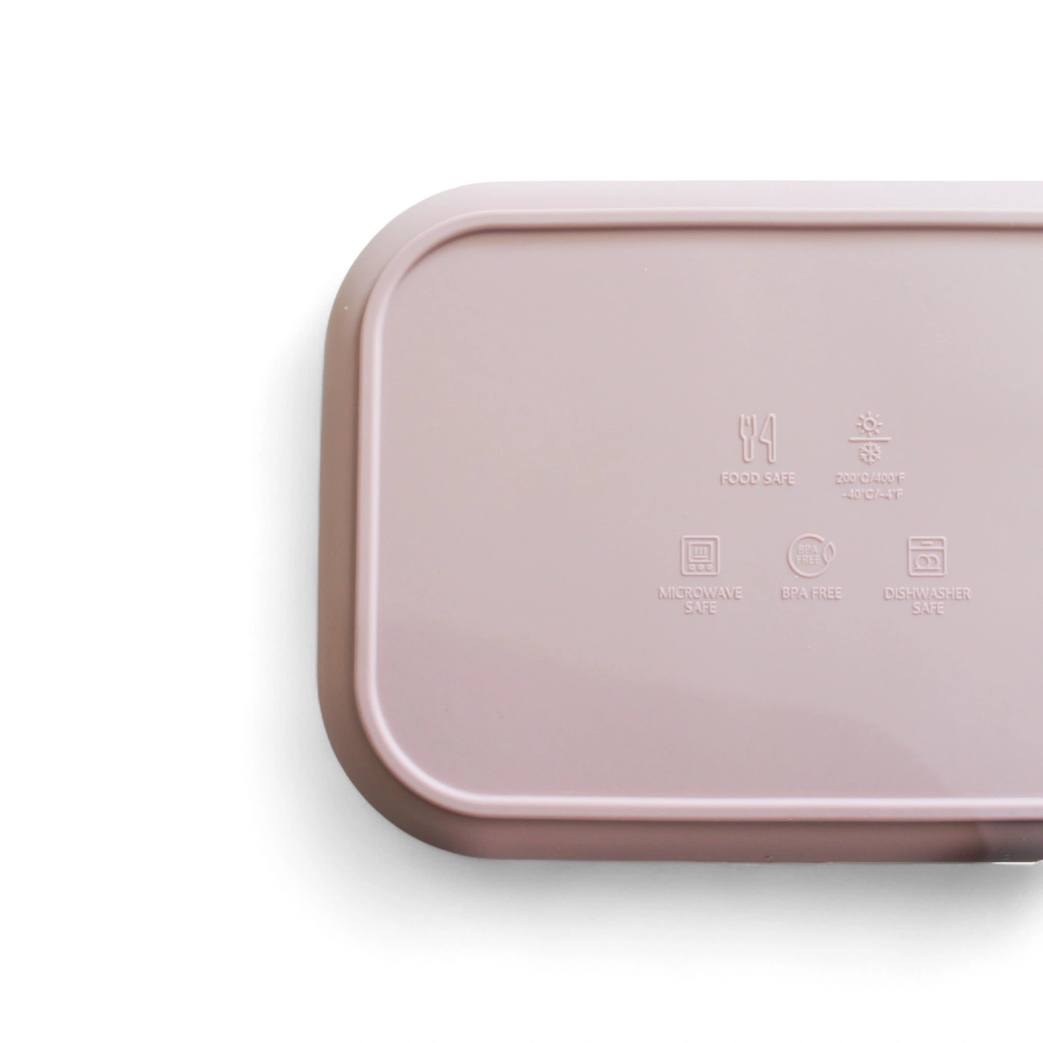 Pink rectangular silicone bento with food safety images on a white background